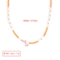 Detail of beaded necklace with orange seed beads and white baroque pearls showing texture - Orange Beads With White Irregular Artificial Pearl Necklace (BE1448MI05)