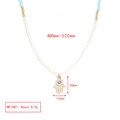 Detail of Hamsa Hand pendant with evil eye motif and colorful beaded strand necklace - Artificial Pearl Gold Beads With Hamsa Hand Pendant Necklace (BE1448MI09)