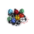 Macro detail of handmade ladybug glass beads showing dimensions 13mm by 9mm size - Multi-colored Ladybug Style (BT810GD02) / 10 Pieces Pack