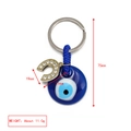 Goldener Hufeisen-Schlüsselanhänger mit blauem Evil Eye und Kristall-Akzenten - Strass Hufeisen Anhänger (BE1363BU03)