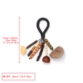 Detail of handmade ethnic pendant with natural nut shells and woven rope tassels - Black Rope Ring Natural Pendant (11)