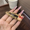 Close-up of leopard print plush bunny BB hair clip with red polka dot bow detail - Leopard Print