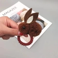 Detailed view of plush brown bunny hair tie with elastic dark red spiral band for kids - Brown Hair Tie