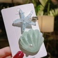 Set de dos clips para el pelo de estrella de mar y concha con perlas blancas - Estilos de Estrella de Mar y Concha / Azul