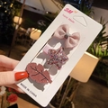 Detailed set of bow and glitter star hair clips on display card for toddlers - Star and Bow Style