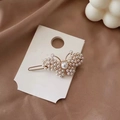 Close-up of golden butterfly hair clip with white pearls on elegant silk background - Butterfly Pearl Hair Clip (AB-28-1)