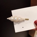 Close-up of golden hair clip with clusters of white pearls on display card - Geometric Cluster Pearl Hair Clip (AB-28-2)