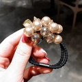 Elegante elastico per capelli con perle champagne e cristalli ambrati su fascia nera - Cachi