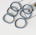 Detailed view of 6-piece grey-blue elastic hair ties with durable tube connectors - Gray