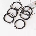 Detail of six high-elasticity braided black hair ties with reinforced plastic joints - Black