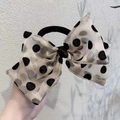 Detail of sheer gold organza bow hair tie with vintage black polka dots texture - Beige Hair Tie