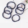 Detail of six navy blue elastic hair ties with black connectors on white background - Navy Blue