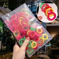 Colorful mini elastic hair ties in a frosted zipper bag for kids and toddlers - Bright Colors