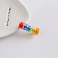 Detailed shot of five colorful resin gummy bear hair clips on a gold metal base - Red/Purple/Blue Style (4572105106318)
