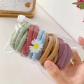 Close-up of colorful high-elasticity hair ties set in a daisy printed zipper bag - Dark Colors Mix