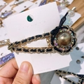 Detail of vintage gold chain hair clip with rhinestones, brown bead, and small bee motif - Colorful Zirconia