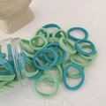 Green gradient seamless hair ties set in a transparent jar with high elasticity - Green