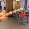 Detail of sweet strawberry charm hair clip featuring crystal beads and telephone wire style - Strawberry Spring Clip