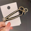 Baroque style BB hair clip featuring black fabric, white pearls, and golden bow detail - New Bowknot