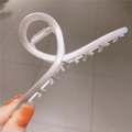 Macro detail of silver cross hollow metal hair claw clip with matte finish and metal spring - Matte Silver