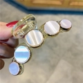 Elegant cat eye stone hair claw clip with gold frame and translucent yellow base - Small 7.5cm White