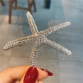 Élégante pince à cheveux étoile de mer avec strass brillants sur monture argentée - Étoile de Mer Argent