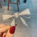 Pince à cheveux noeud argentée avec perles blanches et strass brillants pour femme - Nœud Argenté