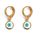 Detail of gold hoop earrings featuring hanging blue devil eye pendants on white backdrop - White