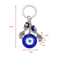 Detailansicht des Evil Eye Schlüsselanhängers mit blauer Glasperle und Palmenanhänger - Palmbaum Stil (BE29BU02)