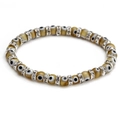 Minimalist evil eye beaded bracelet with amber resin charms and sparkling silver accents - Tan