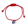 Detail of red braided evil eye bracelet with white pearl and adjustable knot - Red