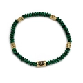 Malachite style beaded bracelet with golden Evil Eye charm beads on a clean white backdrop - Black and Green (BE861GD00)