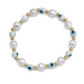 Detail of beaded evil eye bracelet with white faux pearls and golden spacers on white backdrop - Round White Pearl Blue Black Eye (BE1348WH00)