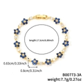 Bracciale a fiori dorati con zirconi blu scuro e bianchi, lunghezza 17,5 cm - Fiore Blu Scuro Oro (B00773-3A)