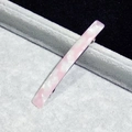 Detail of pink marble acetate hair clip with silver spring metal fastener on velvet - Pink Marble Pattern