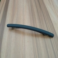 Macro view of minimalist matte grey hair clip showing metallic spring mechanism detail - Gray