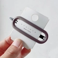 Minimalist grey-purple oval hair clip with metal duckbill pin on display card - Light Coffee