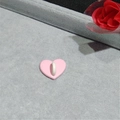 Pink heart-shaped phone grip accessory with white ring holder on a grey velvet display - Small Heart Pendant / Pink