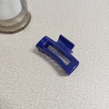 Detail of dark blue rectangular hollow hair claw clip with multi-tooth design - Dark Blue