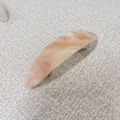 Detail view of French marble pattern hair clip with peach cream finish and metal spring clip - Pink