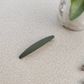 Detail view showing matte dark green spring hair clip with minimalist frosted finish texture - Army Green