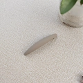 Detail of matte Morandi brown hair clip showing sleek texture on fabric background - Beige Coffee