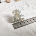 Macro detail of a 4cm small marble pattern hair claw clip with acetate finish and metal ruler - Gray Blue Floral