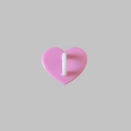 Detailed view of pink heart-shaped phone accessory with a white attachment hook - Pink