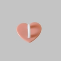 Pink heart-shaped resin phone hook accessory with a white attachment loop - Orange