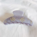 Macro detail of lavender acetate flower hair claw clip with sparkling star crystal inlay - Taro Purple