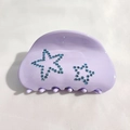 Dettaglio della pinza per capelli lavanda in acetato con strass blu a forma di stella - Lavanda