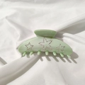 Dettaglio molletta per capelli in acetato verde chiaro con stelle di strass su seta - Verde smeraldo