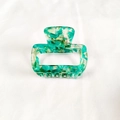 Detail of square emerald green and pearl white marbled hair claw with polished finish - Transparent Green Series