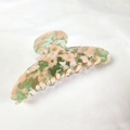 Detailed macro view of 12cm acetate hair claw featuring a colorful marble texture - Fresh Green